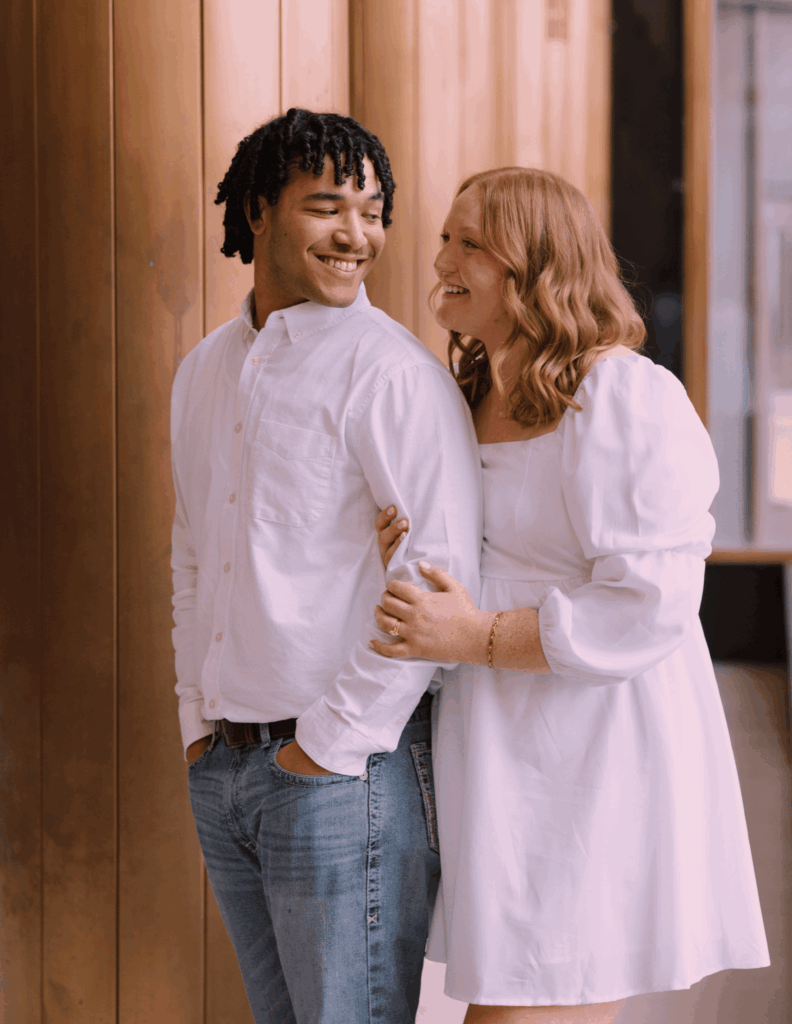 Kayla and her husband, Ethan posing for a photo.