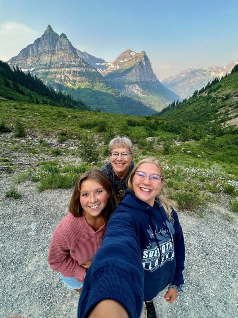 ChristiAnna with her family posing for a photo while on a hike.